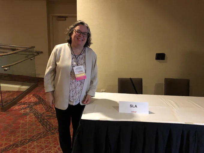 SLA President Lavallée-Welch at SLA table at ASIS&T 2022 Annual Meeting