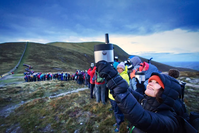 Lumenators line up with their Geolights at Slieve Donard next to the Mourne wall. 