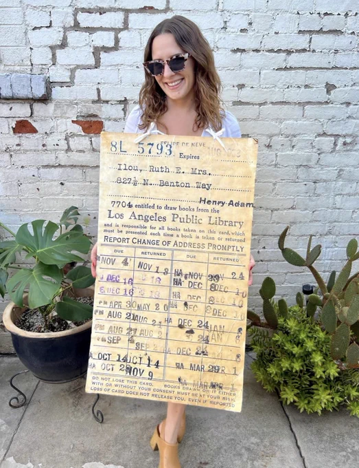 Person wearing halloween costume of old library card