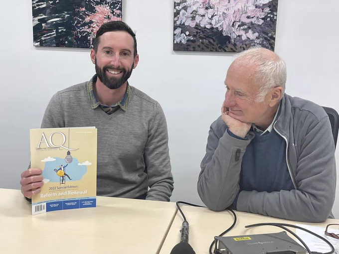 Dr Mike Kinsela holding Australian Quarterly magazine with Robyn Williams