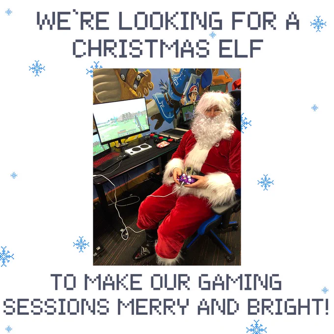 Father Christmas is sat holding a controller playing a game