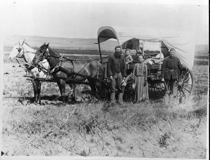 Family with Their Covered Wagon During the Great Western Migration