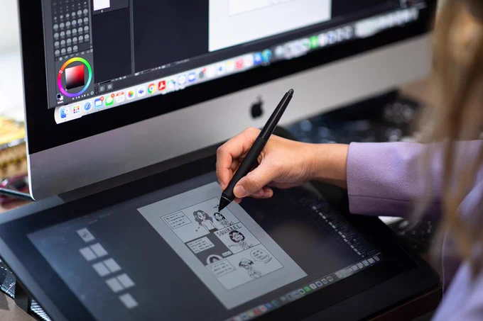 Person drawing on a digital screen with stylus pen 