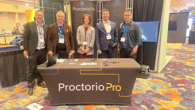 Professors from Anadolu University stopping at ProctorioPro booth at DevLearn conference