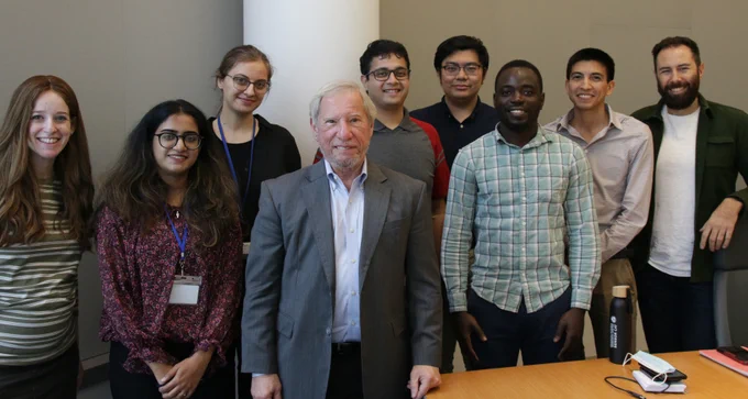 Dennis Liotta (center) with Graduate Center Ph.D. students. From left: Tamar Mehlman, Biochemistry Ph.D. program; Priyasha Deshpande, Biochemistry Ph.D. program; Naxhije (Gia) Berisha, Chemistry Ph.D. program; Dhawnit Dave, Chemistry Ph.D. program; Jim Xu, Biochemistry Ph.D. program; David Dansu, Biochemistry Ph.D. program; Alfredo Vidal-Ceballos, Biochemistry Ph.D. program; and Sami Sauma, Biology Ph.D. program. (Photo credit: Shanté Booker)