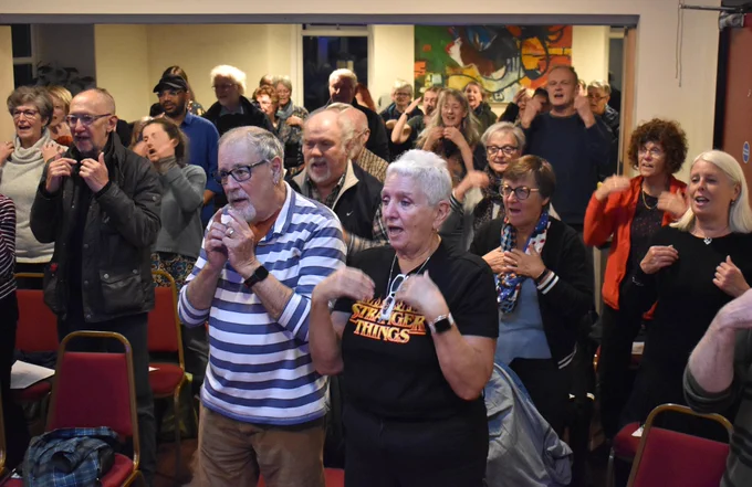 Some of our community choir in action at The Gregson Centre, Lancaster, taking part in a workshop rehearsal ahead of performing as part of our installation 100 Stories High
