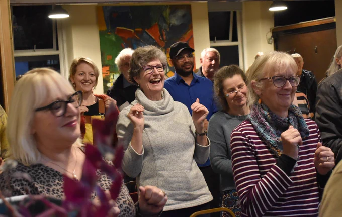 Some of our community choir in action at The Gregson Centre, Lancaster, taking part in a workshop rehearsal ahead of performing as part of our installation 100 Stories High