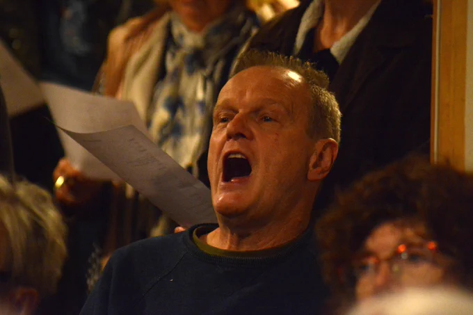 Some of our community choir in action at The Gregson Centre, Lancaster, taking part in a workshop rehearsal ahead of performing as part of our installation 100 Stories High
