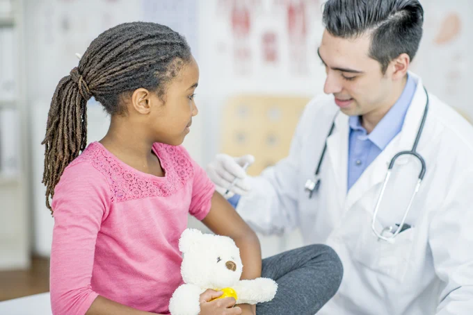 Image contains: Person, Human, Clothing, Apparel, Lab Coat, Coat