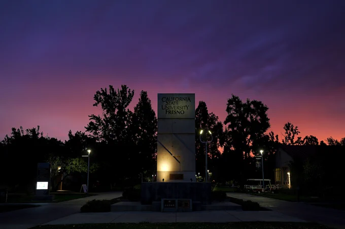 Fresno State monument at night.