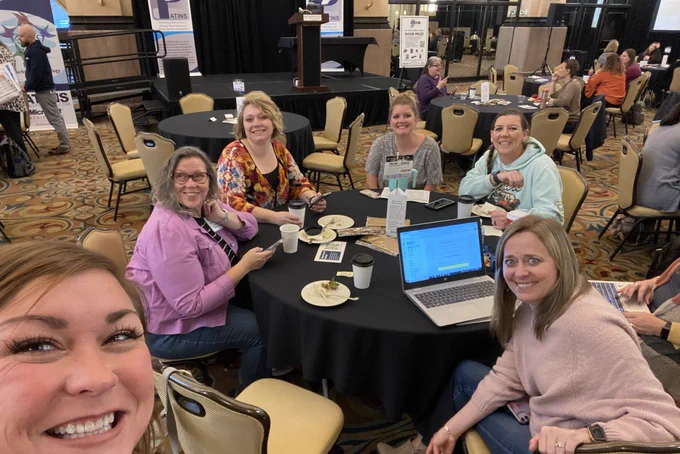 Educators sitting at table