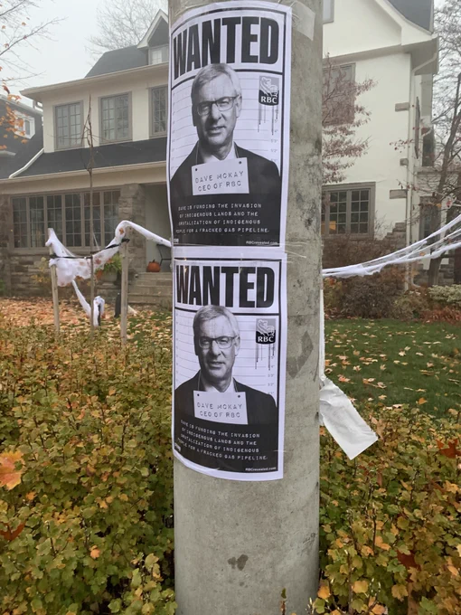 Wanted posters of Dave McKay on a pole