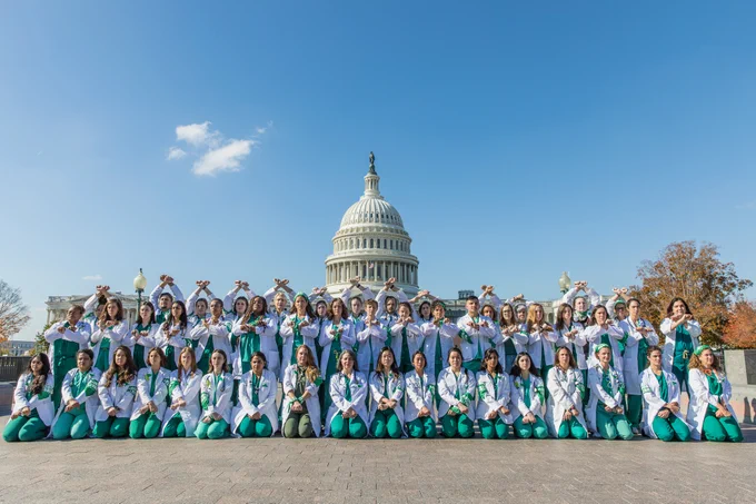 Powerful image of dozens of doctors for abortion access gathered in front of the United States Capitol.