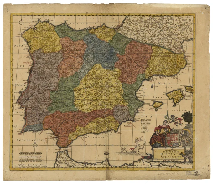 Engraved, hand-colored map of the Iberian peninsula with heraldic symbols and flying angels in the lower right
