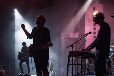 A photo of Frightened Rabbit on stage.