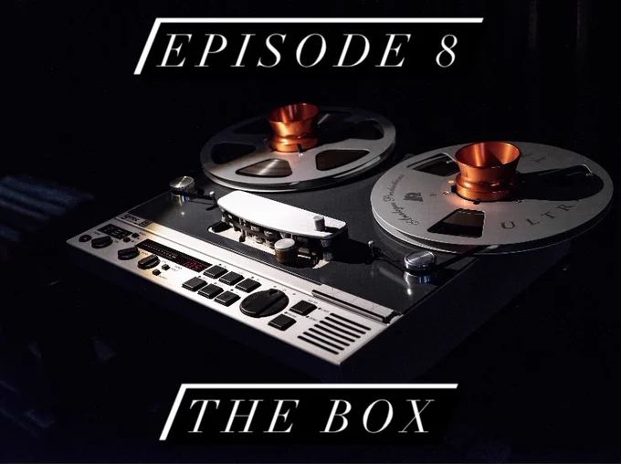 An analog sound recorder lit by a single light source in a dark room. The text above it reads “Episode 8” and below “The Box.”