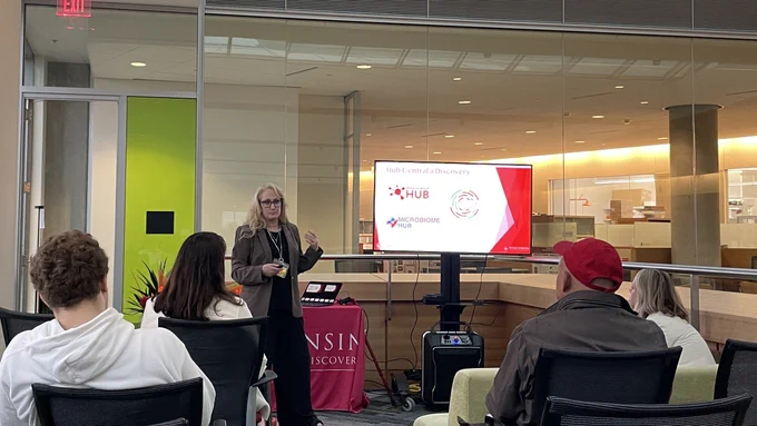 Jo Handelsman presents an overview of the interdisciplinary science done at the Wisconsin Institute for Discovery to guest Elzie Higginbottom and his family.
