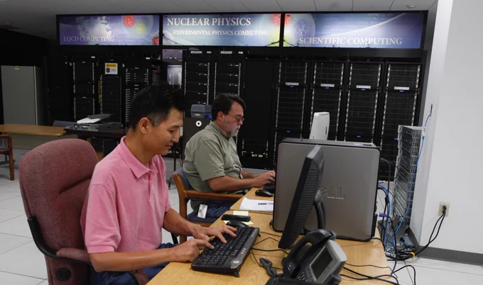 Two computer scientists work in Jefferson Lab's Data Center.