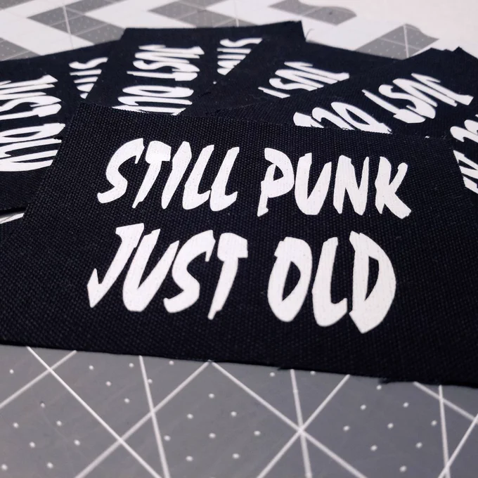 Canvas Patch reading 'Still punk, just old'.