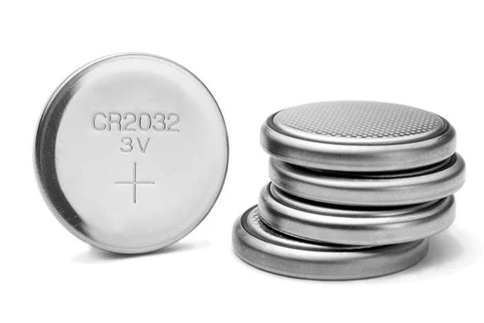stack of button batteries which resemble coins