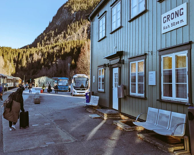 Train station at Grong with busses in background 