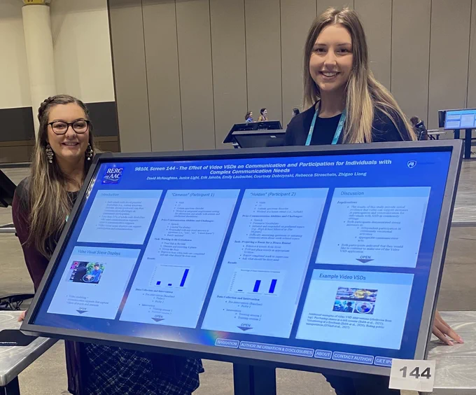 Becca and Courtney with poster at ASHA 22