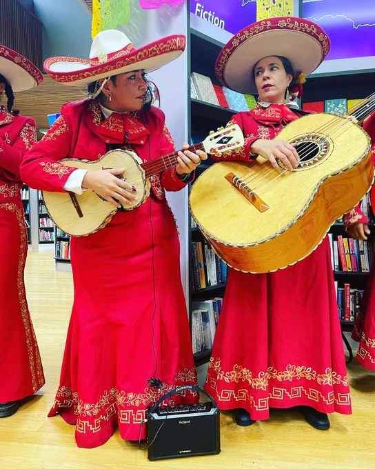 Female mariachi performers in red dresses