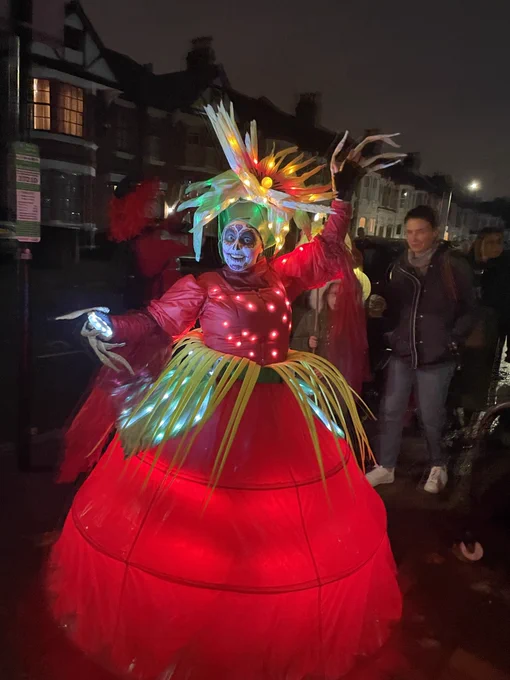 La Catarina Performer in red and green light up costume