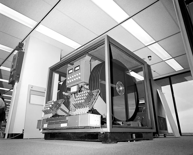 Black and white photo. A large, 1970s era computer in an office.