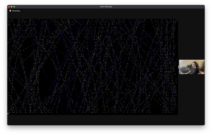 A web of particle strands spread out over a black background, each letter in either in green, white, or purple