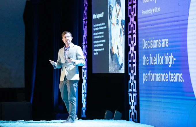 Darren Murph speaking on GitLab TeamOps at WorkSpaces 2022 in California