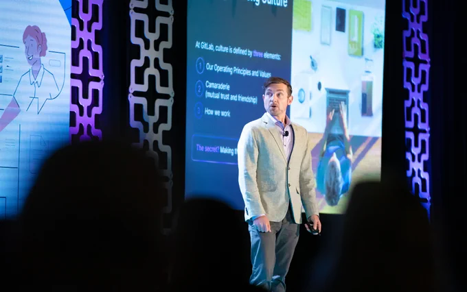 Darren Murph speaking on GitLab TeamOps at WorkSpaces 2022 in California