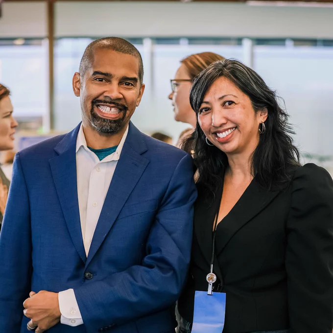 Two people smiling