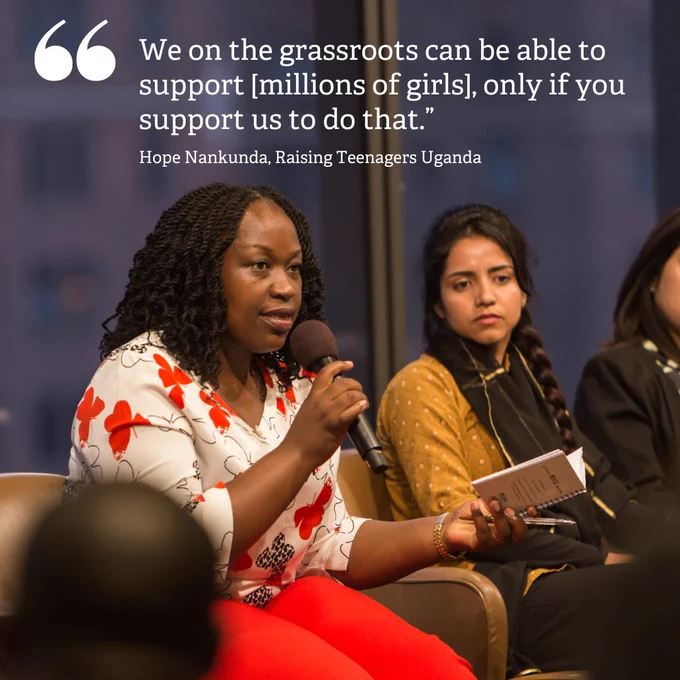 Image: Hope Nankunda from Raising Teenagers Uganda is holding a microphone.
Text: "We on the grassroots can be able to support [millions of girls], only if you support us to do that!"
Hope Nankunda, Raising Teenagers Uganda