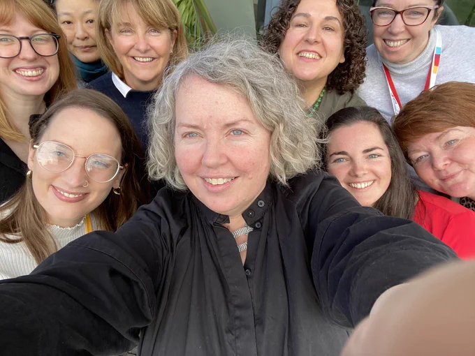 Selfie by Linda surrounded by eight female researchers.