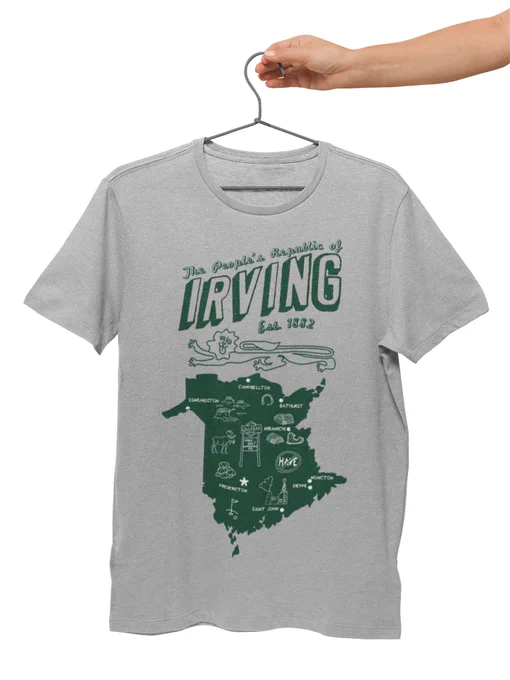 Grey t-shirt with the words "the people's republic of Irving" the design is reminiscent of a tourist souvenir and it features the province, with notable cities labelled and hand-drawn images of things like the Big Stop sign, the lion on the new Brunswick flag, oil refineries, cut down trees, the word "have" crossed out, empty lobster trap and other silly jokes