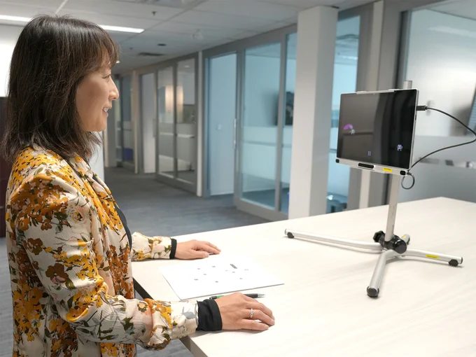 Tobii Dynavox i5 camera is attached to a tablet that is secured on a desktop mount. Our SET-BC OT, Pearl, controls the movement on the screen using Eye Gaze technology.