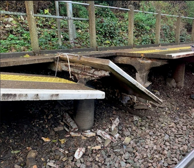 A large piece of platform dislodged onto the track