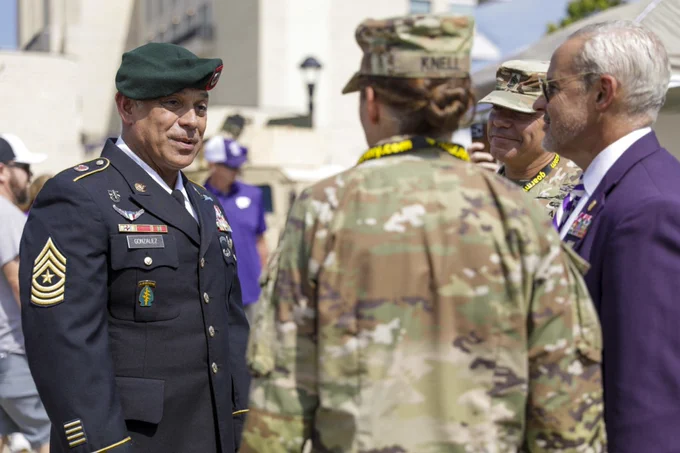 Sgt. Maj. Antonio Gonzalez (left) converses with Army leaders from the 1st Infantry Division and Kansas State University during the KSU Fort Riley Day event, September 17, 2022.