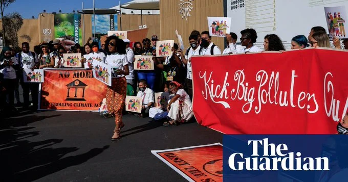 Climate activists protesting against big polluters at the Sharm el-Sheikh international convention centre. 