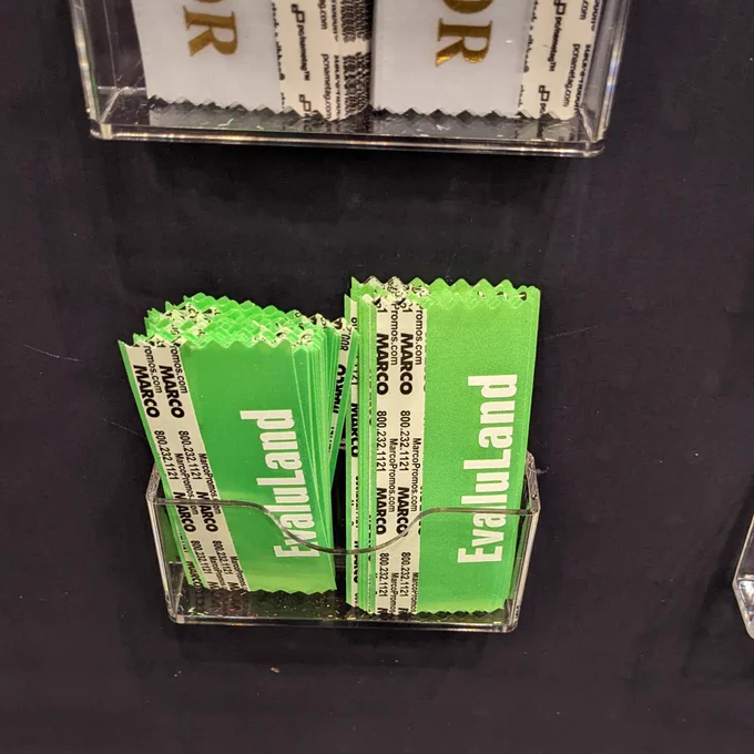 Picture of the name tag ribbons saying evaluland