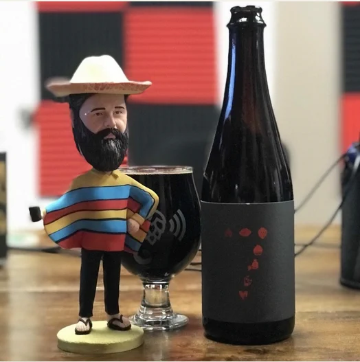 Monday Night Brewing's 7 Deadly Stouts, and Brian the Bobblehead.  I have no idea what's he's wearing, but he's got collars and festive colors. He's ready for any occasion.