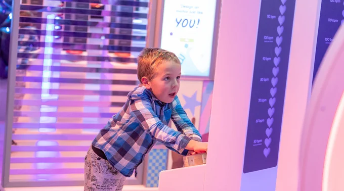 Child at Eureka! Science   Discovery interacting with exhibit