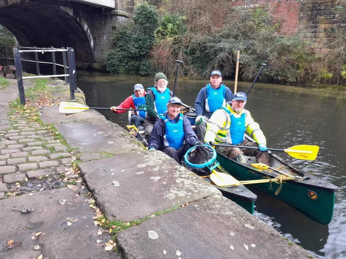 The fab CRT North West volunteers in Canadian Canoes. The canoes have bags of litter picked from the Leeds Liverpool canal and the banks. Blackburn.