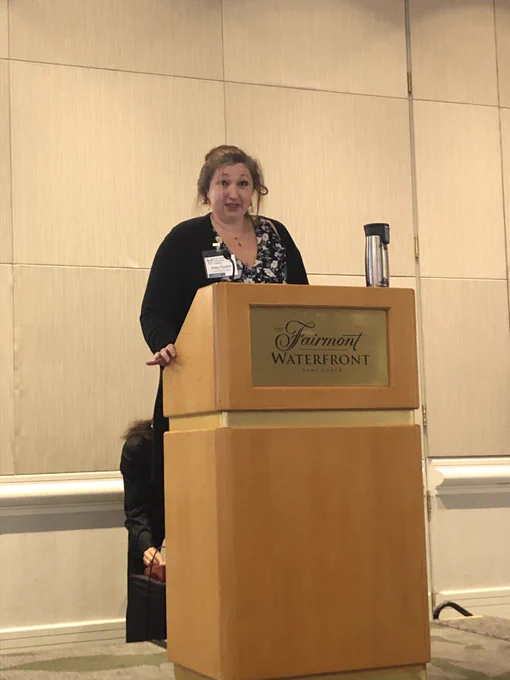 Erika Tucker at the speaker podium.