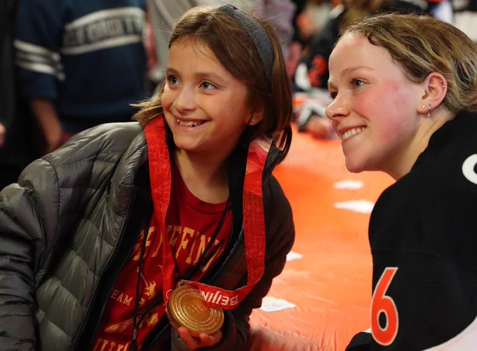 Sarah fillier with fan and olympic gold medal