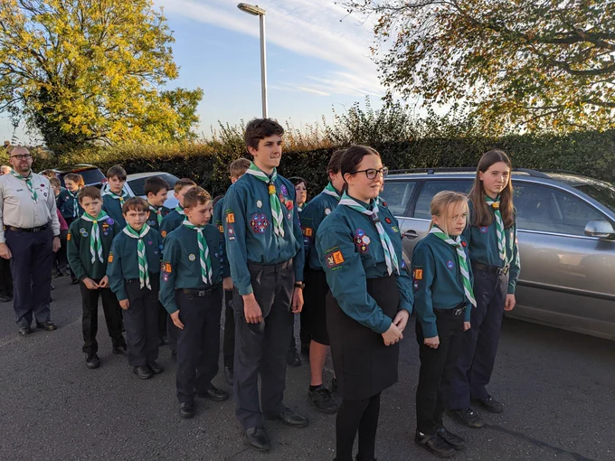 Scouts in uniform stood in line 3 Scouts wide