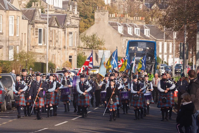 Burntisland Pipe Band leading the Remembrance Sunday parade after the war memorial service