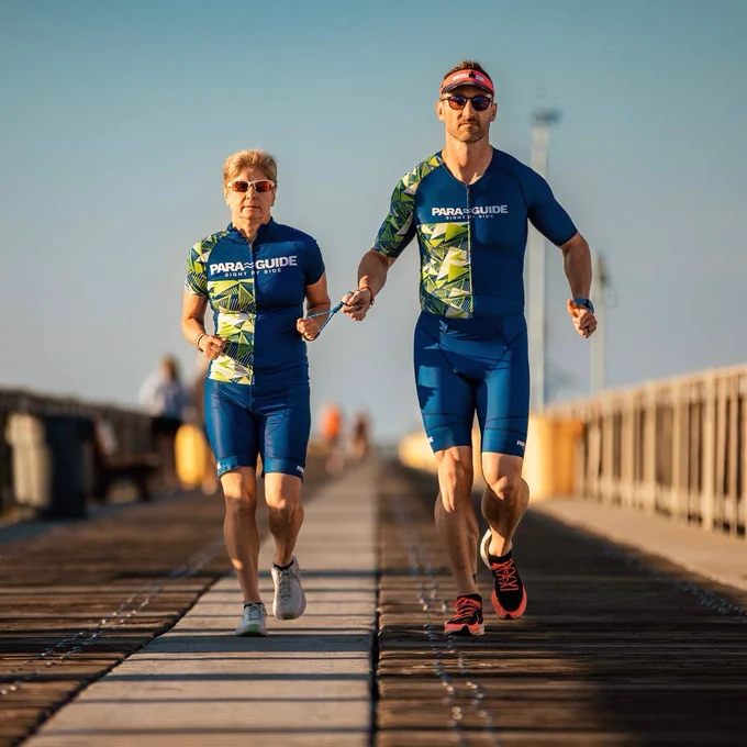 Kellie and Scott running with a tether in para guide kits