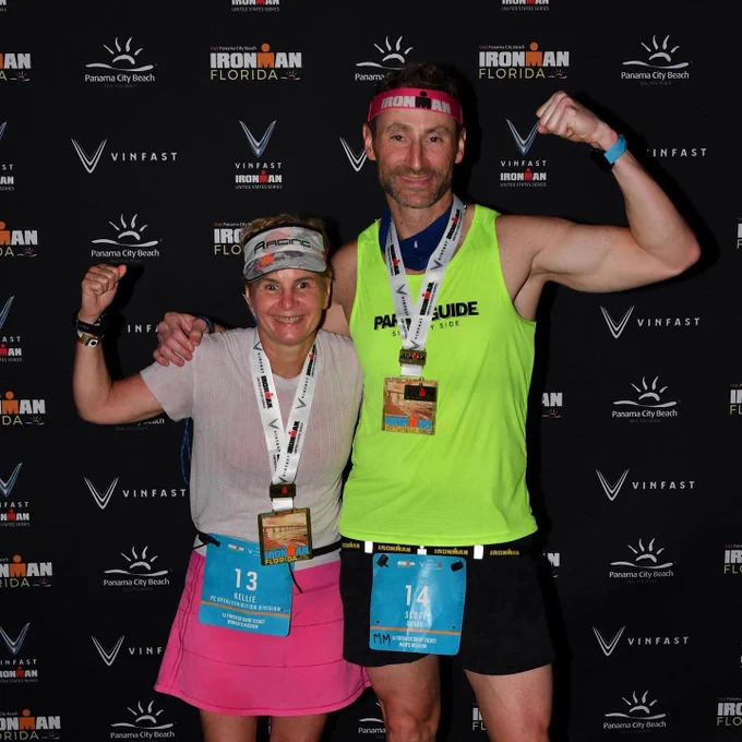 Team Kellie doing muscle arms after the finish